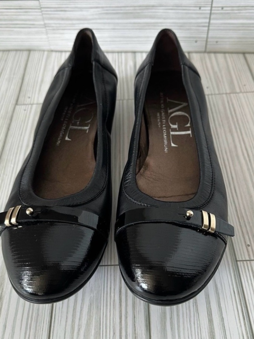 AGL Black Patent Cap-Toe Ballet Flats with Gold Accent